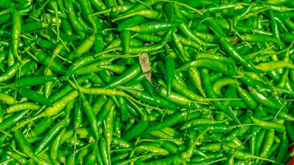 Green pepper or chili from the farm, Close up or macro fresh beautiful Green peppers on the market texture and background,