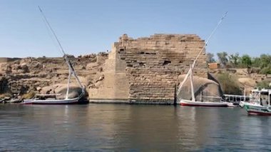 pleasure boat navigating the river nile in front of the island of Elephantine