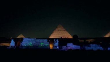 Views of the Giza plateau, the pyramids and the Sphinx illuminated at night
