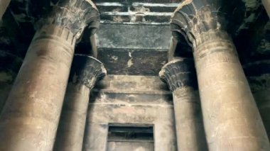 Columns of the temple of Edfu and roofs stained by the smoke of the fire