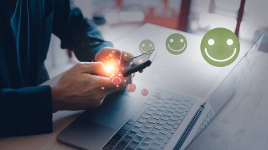 increasing customer satisfaction businessman using mobile phone give rating customer review by increase happy face emotional and reduce sadly face emotional.