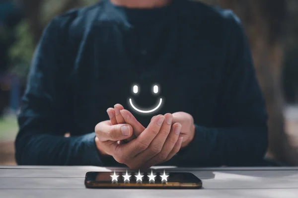 survey feedback Customer service satisfaction survey concept. man shows satisfaction by thumb up and five stars in satisfaction and give a feedback recommendation. happy emotion customer review