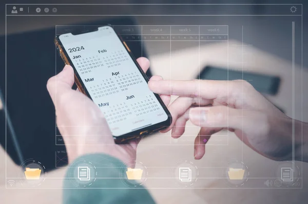 Concept of time management financial planning and reminder for 2024. man using smartphone working with calendar 2024, business planning marketing and investment, schedule appointment meeting