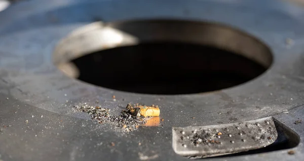 stock image cigarette butt on metal bin