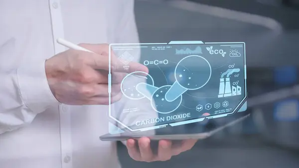 Reduce CO2 emissions and carbon footprint to limit global warming and climate change. Sustainable development and green business, man pointing at report and virtual diagram showing co2 emission icon