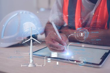 Sanal rüzgar türbinli tablet ve kalem kullanan bir mühendis küresel ısınma ikonlarıyla birlikte CO2 emisyon kavramını azaltarak küresel ısınma enerjisini sınırlamak için karbon ayak izi iklim değişikliği