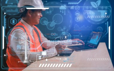 Mühendis, CO2 salınımını ve karbon ayak izini, küresel ısınma iklim değişikliğini azaltmak için sanal rüzgar türbini diyagramı üzerinde çalışan bilgisayar tableti ve kalem kullanıyor. Sürdürülebilir kalkınma ve yeşil enerji