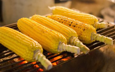 Five grilled corn on the cob at night market in Koh Phangan island, Thailand. Yummy healthy food