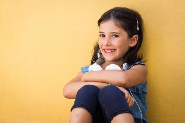Cute Little Girl Sitting Headphones Neck Cheerful Kid Looking Camera — Stock Photo, Image