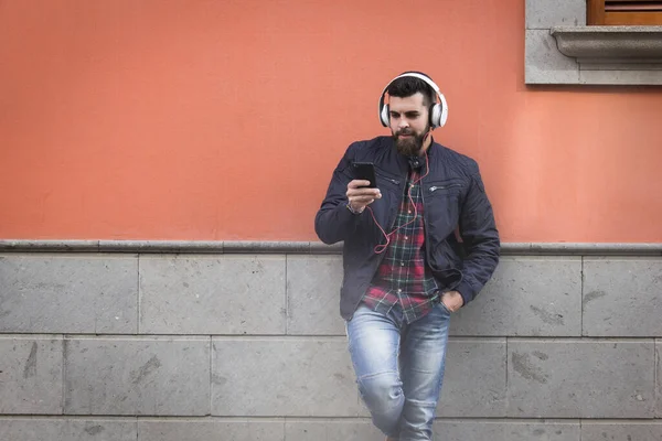 Modern Looking Young Man Headphones Leaning Brown Gray Wall Hipster — Stock Photo, Image