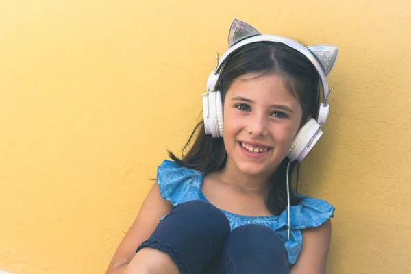 Sweet Little Girl Smiles Cat Ears Headphones Portrait Cheerful Kid — Stockfoto