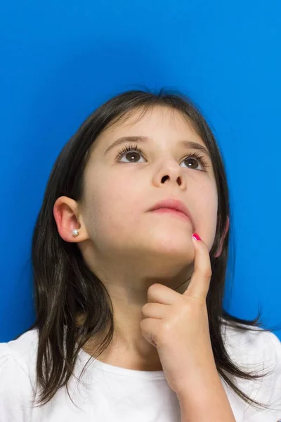 Little Girl Looking Finger Mouth Thinking Idea Blue Background Imagination — Stock Photo, Image