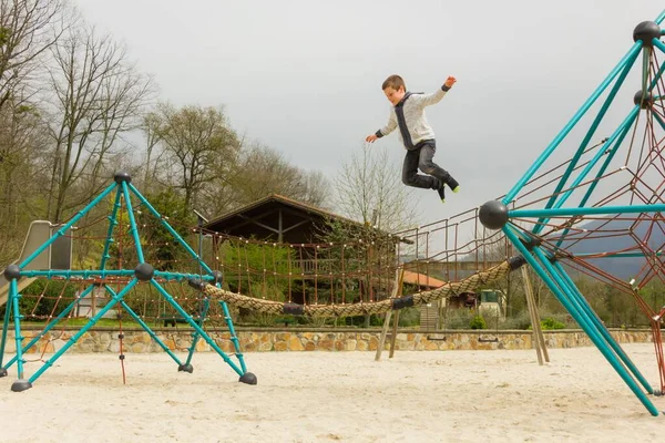 Young Kid Jumping Geometric Dome Structure Empty Playground Bilbao Boy — Stock Photo, Image