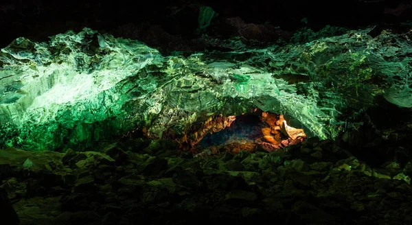 stock image Panoramic view of green cave lava tube illuminated in Canary Islands. Geological cavern formation, tourist attraction concepts
