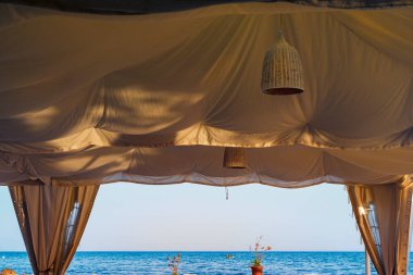 Pergola of Mediterranean food restaurant in front of the sea in Malaga 