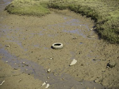 polluting rubbish in a dry riverbed