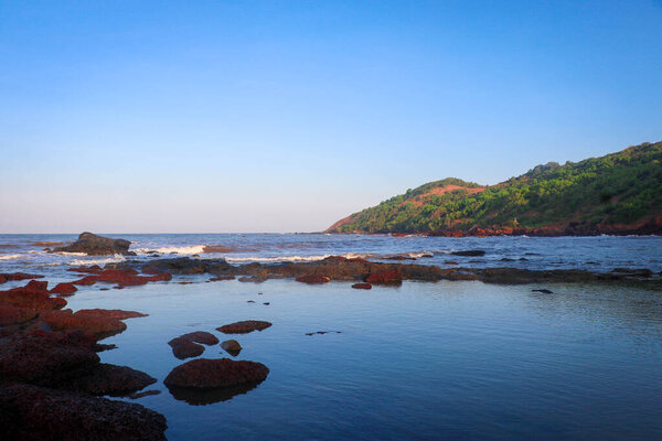 Anjuna Beach in the Morning with Hill and Rocky View in North Goa, India