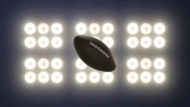 Super bowl football explosion concept on floodlight background