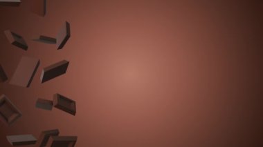 Chocolate cubes falling on brown background with copy space