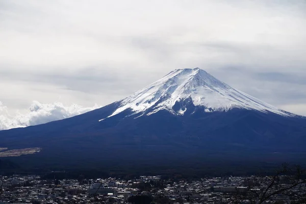 Overlooking Mount Fuji in Japan under a town on a cloudy day