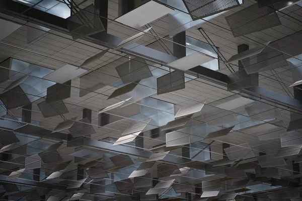 Geometrik metal tavan, camlardan içeri güneş ışığı giriyor.