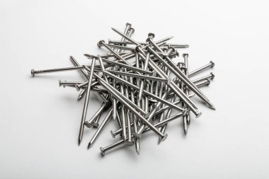 Construction and carpenter nails on a white background