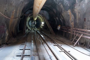 An underground tunnel, rails and wagons for the city's wastewater