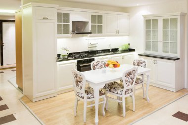 kitchen interior with white fireplace in the background