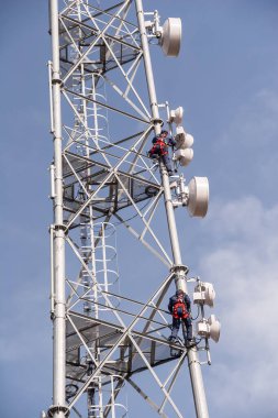 Technicians who maintain the GSM base station