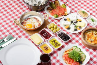 breakfast table and snacks with meat and wine and toast. top view