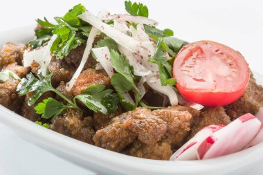 Cold appetizer made with veal liver on a white plate