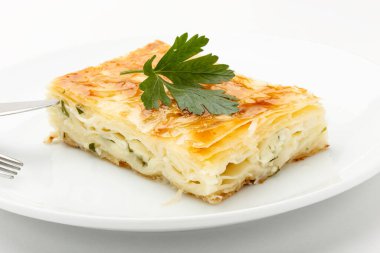 Oven-baked pastry made with cheese, thinly rolled phyllo and parsley