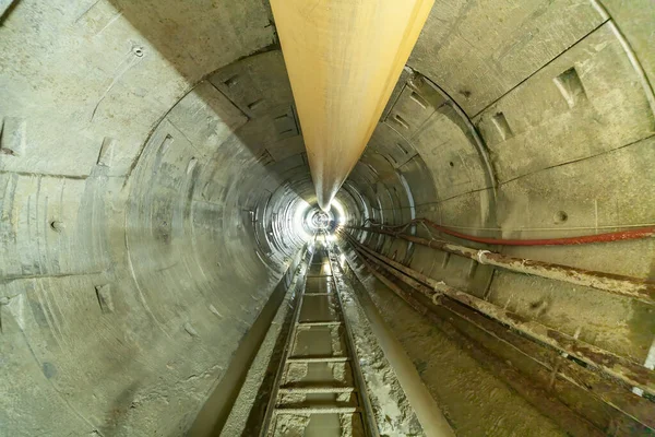 An underground tunnel, rails and wagons for the city\'s wastewater