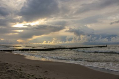 Souther Baltic sea coast, Northern Poland, Pomerania, sandy beach, dramatic sky, late winter time