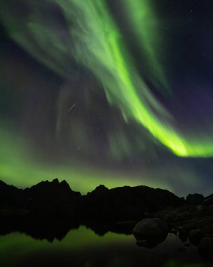 Strong Northern Lights Above the Solbjornvatnet lake, Lofoten