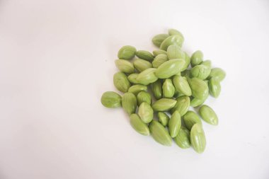 Pete or smelly green beans on white background