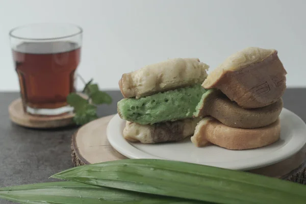 Kue Pukis are traditional Indonesian cakes. Made with a simple batter of eggs, sugar, and flour, these round treats are a sweet addition to any snack time. Enjoy with a cup of tea or coffee.