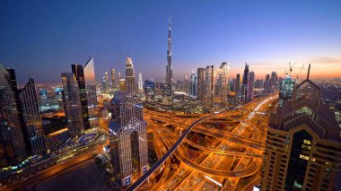 dubai skyline with skyscrapers in night.