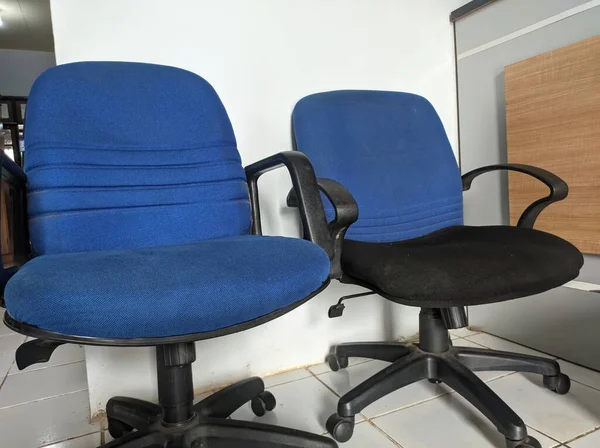 view of two blue chairs in office