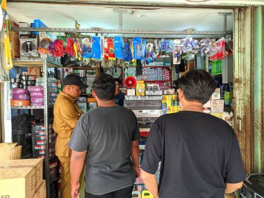 view of several people shopping for electronics
