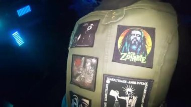 Back stitchers on the vest of an underground DJ