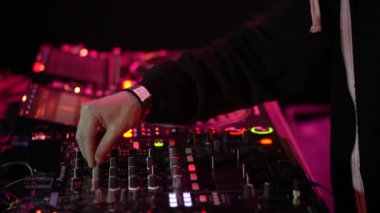 DJ hands close up at an underground party