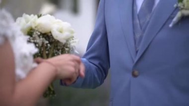 Pulling on a ring on a groom