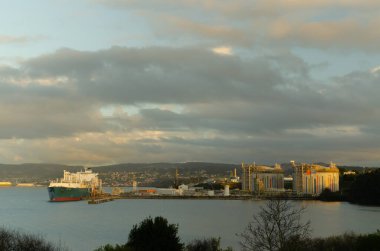 Gas tanker unloading liquid natural gas in a regasification plant in Spain, in Mugardos, Galicia
