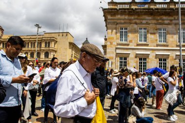 BOGOTA, COLOMBIA - 26 SEPTEMBER 2022. Peaceful protest marches in Bogota Colombia against the government of Gustavo Petro called la marcha de la mayoria. Marches against the law reforms of the new Colombian government. clipart