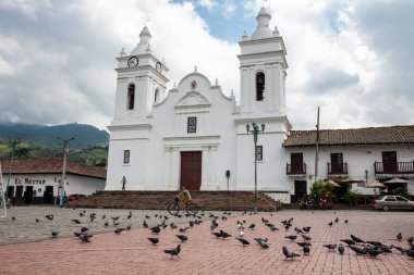 GUADUAS, COLOMBIA - JANUARY 12, 2024: View of the central square in the city of Guaduas located in the Department of Cundinamarca in Colombia. clipart