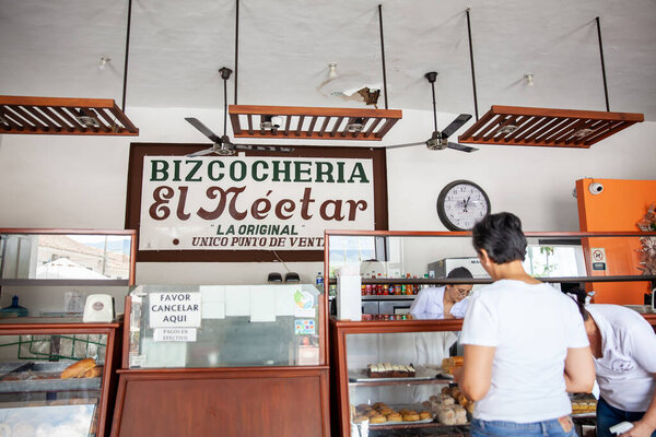 GUADUAS, COLOMBIA - JANUARY 12, 2024: Historical El Nectar pastry shop at the central square of the Heritage Town of Guaduas founded in 1901.