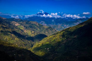 The amazing landscapes of the Central Ranges on the ascent to the High of Letters between the cities of Fresno and Manizales in Colombia clipart