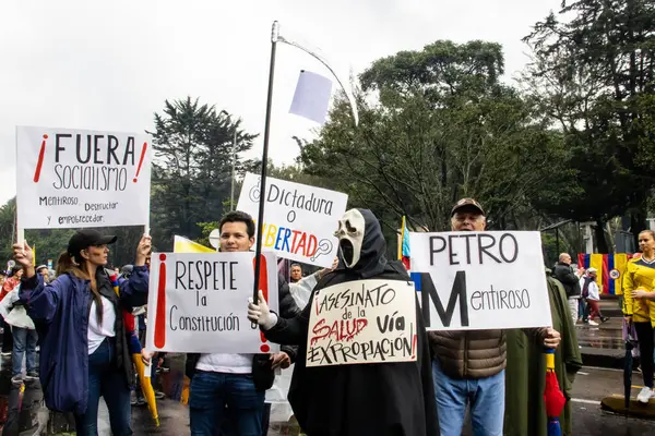 stock image BOGOTA, COLOMBIA - 21 April 2024. March asking for Gustavo Petro impeachment. Peaceful protest march in Bogota Colombia against the law reforms of Gustavo Petro government.