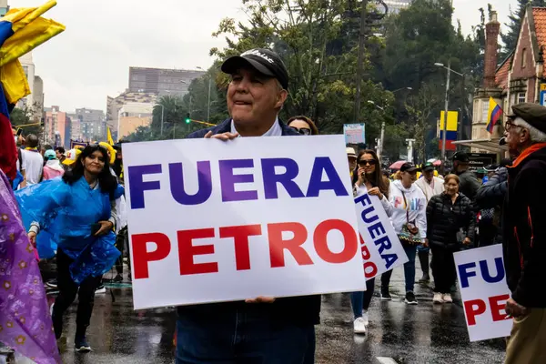 stock image BOGOTA, COLOMBIA - 21 April 2024. March asking for Gustavo Petro impeachment. Peaceful protest march in Bogota Colombia against the law reforms of Gustavo Petro government.